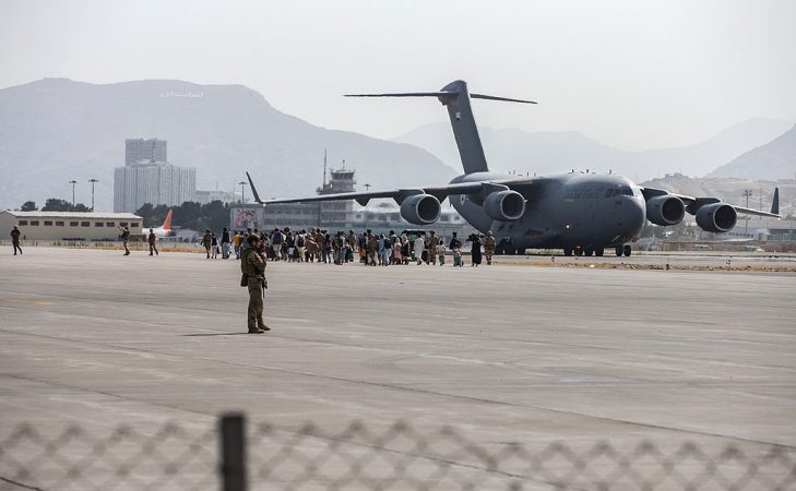 Evacuees board a U.S. Air Force plane at Hamid Karzai International Airport, Kabul, Afghanistan,