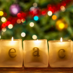 candle holders with letters arranging to spell 'peace'