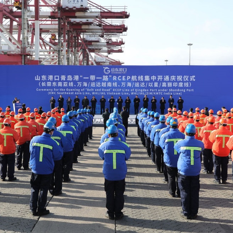 Workers attend the ceremony for the Opening of 'Belt and Road' RCEP Line at Qingdao Port, China on January 19, 2021
