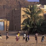 Children playing with a football near Say'un, Yemen