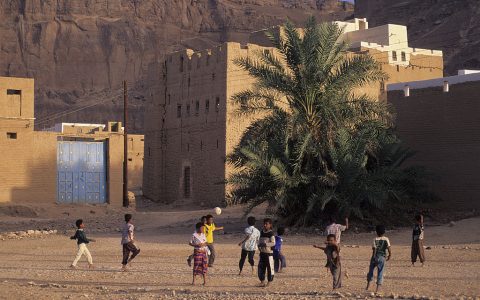 Children playing with a football near Say'un, Yemen