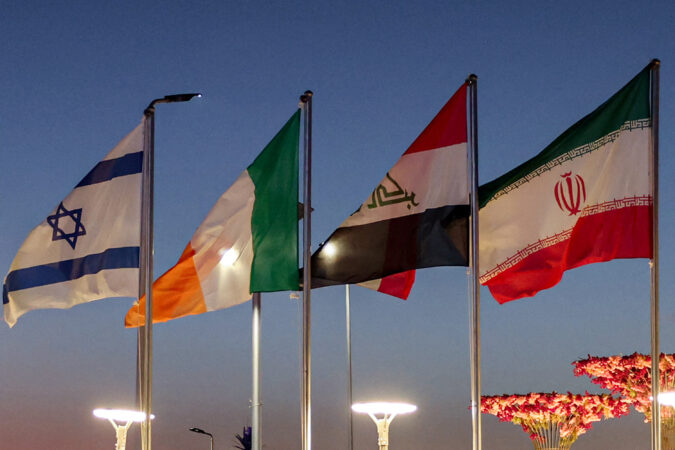 The flags of United Nations member states (R to L) Iran, Iraq, Ireland, and Israel fly in alphabetical order during the COP27 climate conference at Sharm el-Sheikh, Egypt, in November 2022. Photo by AHMAD GHARABLI / AFP via Getty Images