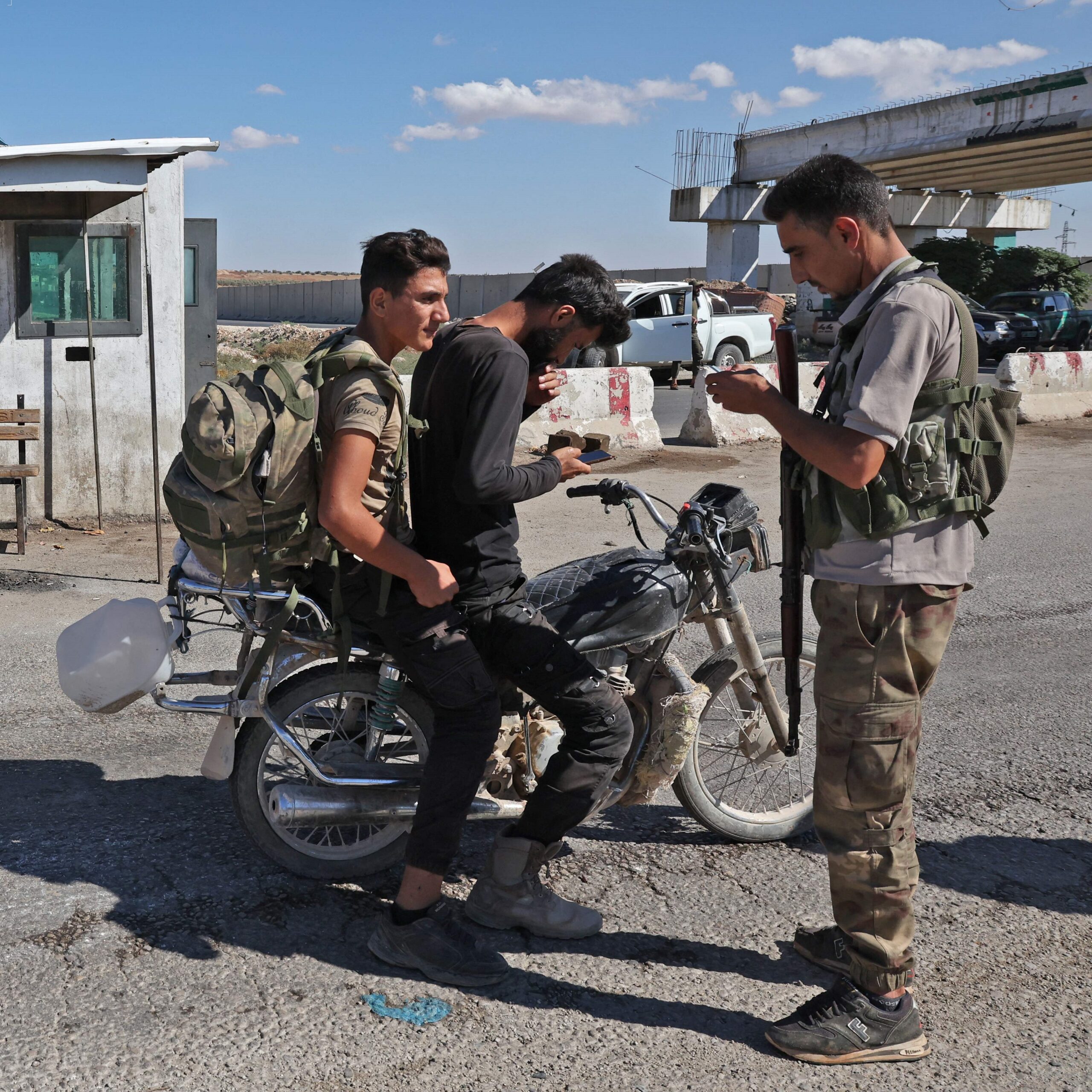 Fighters from the Turkish-backed Free Syrian Army are deployed on a checkpoint in the area of Kafr Jannah on the outskirts of the Syrian town of Afrin on 19 October 2022