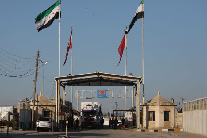 A truck crosses from Turkey into rebel-held north Syria via the Bab al-Salama crossing as part of an aid convoy in February 2023