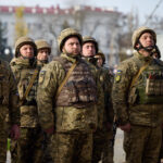 Ukrainian soldiers line up outside