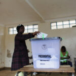 A Kenyan woman casts her vote at a polling station during the Kenyan presidential election rerun in 2017