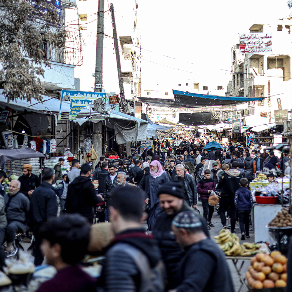 People shop at a bazaar in Idlib, Syria.