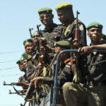 Anti-riot policemen patrol the streets of Jos, in central Nigeria