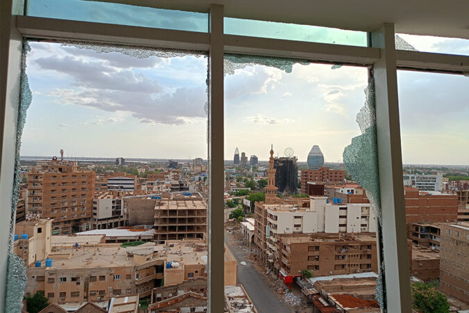 A view of the city of Khartoum through smashed windows