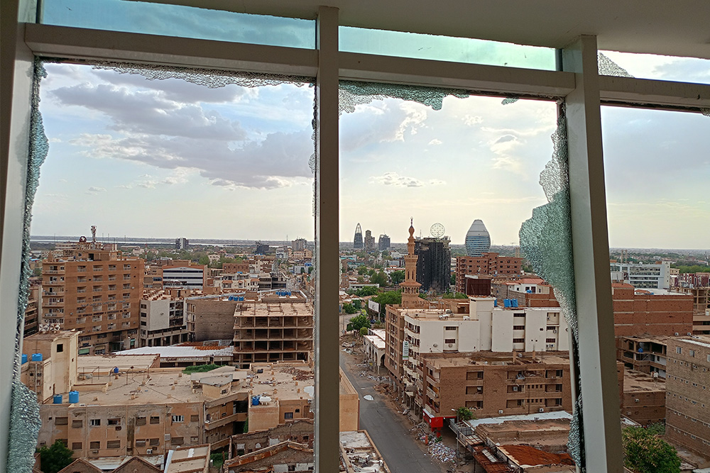 A view of the city of Khartoum through smashed windows