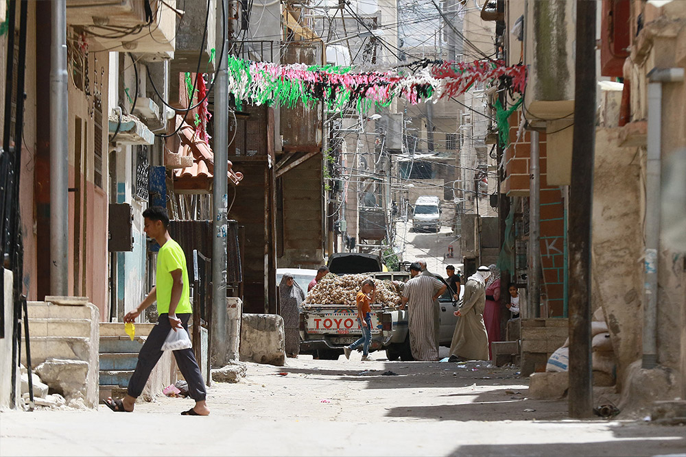 A man walks in the street in the Palestinian refugee camp of Baqa'a near Amman, Jordan.