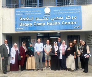 A group poses outside the health centre