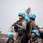 Soldiers of the United Nations Organization Stabilization Mission carry guns in the Democratic Republic of the Congo